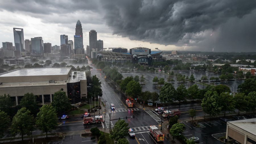 Hurricane Preparedness in Charlotte, NC 1 Charlotte NC skyline during hurricane warning with storm clouds and emergency vehicles